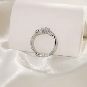 Macro view of a silver adjustable ring featuring a cute dog paw design and zircon stone