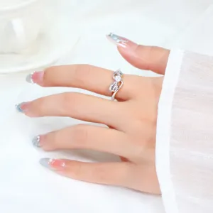 Macro view of cute silver puppy ring with sparkling zircons and paw design worn on finger