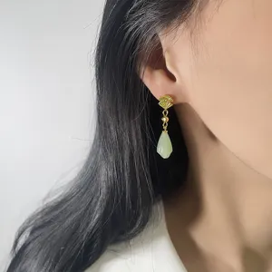 Elegant gold fan earrings with light green jade drop for a classic Chinese style look