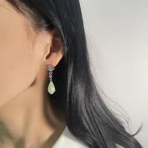 Elegant Chinese style fan-shaped earrings with green Hetian jade pendants on model