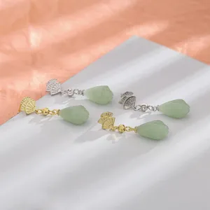 Elegant fan-shaped drop earrings with green jade-like teardrop pendants in gold and silver.