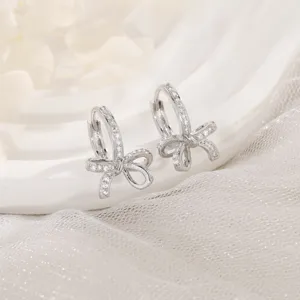 Elegant silver bow knot hoop earrings with sparkling pavé zircon stones for women