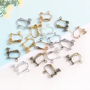 Close-up detail of adjustable screw earring converters, DIY metal jewelry findings.