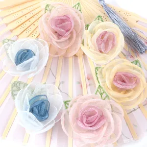 Organza flower detail close-up, handmade stereoscopic camellia rose for DIY accessories.