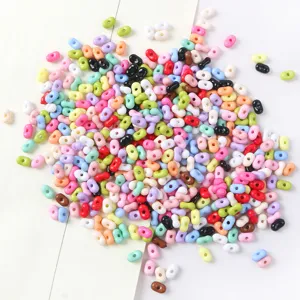 Close-up of vibrant candy-colored peanut-shaped beads for DIY jewelry making