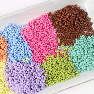 High-quality detailed close-up of colorful candy-colored peanut-shaped beads for DIY jewelry