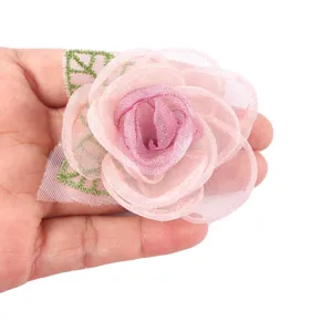 Handmade organza pink rose flower craft accessory for DIY brooch and apparel decoration.