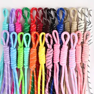 Macro view of variety colorful braided nylon lanyards with knotted detail and loops