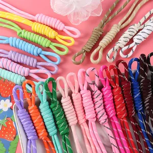 Vibrant assortment of colorful hand-woven lanyards for bags and phones in bright shades