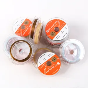 Close-up detail of flexible nylon-coated stainless steel jewelry wire spools for crafting.