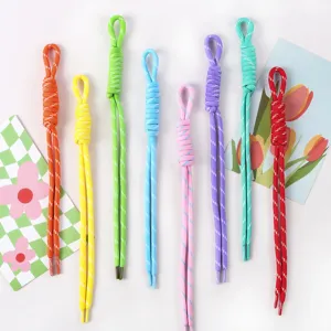 Collection of colorful handmade woven lanyards for DIY accessories and phone charms