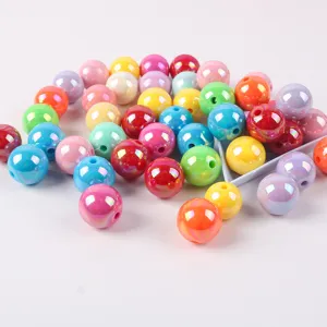 Close-up of macaron colored acrylic AB round beads with iridescent plating for DIY jewelry
