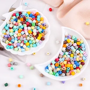 Close-up detail of colorful 6mm pony beads in bowls, perfect for DIY handmade jewelry crafts.