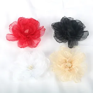 Detailed view of 9cm handmade chiffon fabric flowers in four colors for DIY hair accessories.