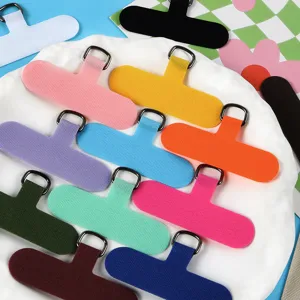 Colorful mobile phone lanyard patch universal non-deforming TPU case tether gasket detail shot.