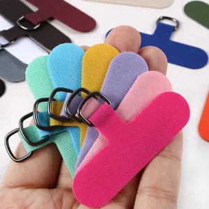 Close-up detail of colorful mobile phone lanyard patches with metal D-rings, solid and durable.