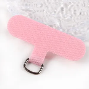 Close up detail of pink phone lanyard tether tab with durable TPU fabric and metal ring attachment.