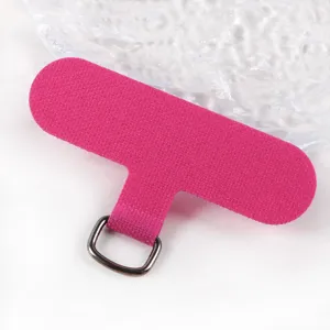 Pink phone lanyard patch with metal D-ring, durable fabric tether tab for universal case.
