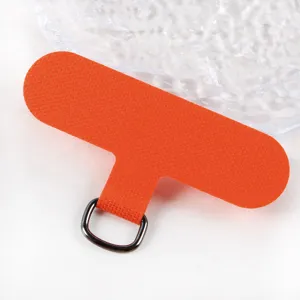 Orange fabric phone lanyard tether patch detail with metal D-ring for universal phone cases.