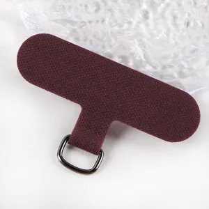 Dark red fabric phone lanyard tether tab detail with metal D-ring universal use