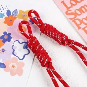 Close-up of red woven nylon rope pendant with decorative knots for bags and phone straps