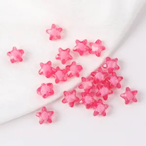 Close-up detail shot of transparent pink acrylic star beads for DIY jewelry making