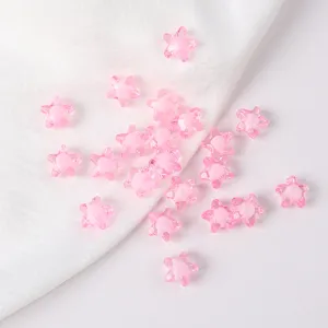 Close-up view of 11mm pink acrylic star beads for DIY jewelry and necklace crafting
