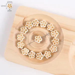 Detailed view of carved lotus flower bodhi root loose beads arranged neatly on a wooden tray.