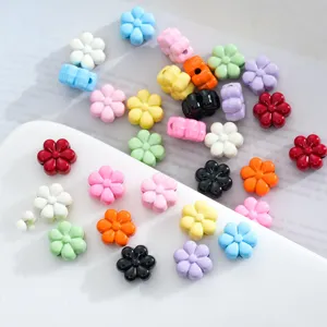 Colorful alloy flower shape loose beads detail shot for DIY jewelry making and phone charms.