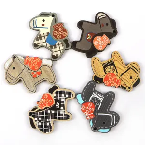 Close-up view of six colorful wooden horse pendants with unique plaid and wood patterns