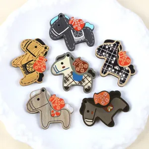 Detailed view of assorted wooden horse charms for DIY jewelry and keychain accessories