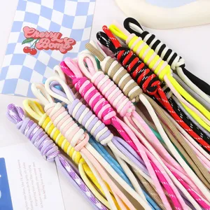 Detailed view of colorful handmade braided nylon ropes for DIY bag pendants and doll accessories