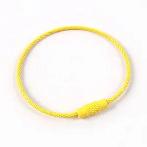 Yellow coated steel wire keychain ring close up display, flexible metal hardware loop detail view.