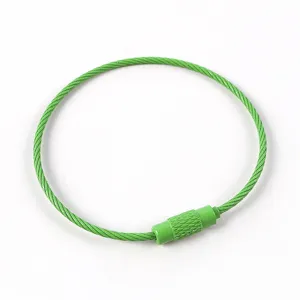 Green coated steel wire keyring detail shot, durable metal cable loop for DIY crafts.