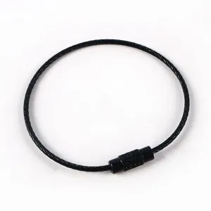 Black steel wire cable key ring loop detail, durable metal connector for DIY crafts.