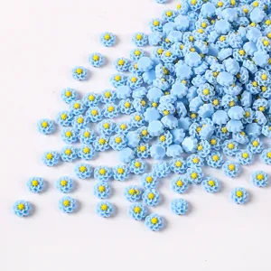 Blue resin flower cabochons detail shot, perfect for nail art decoration and DIY phone case crafts.