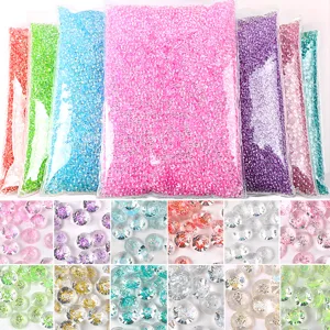Detailed grid view of colorful sparkling resin rhinestones for nail art and DIY crafts.