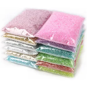 Detailed view of colorful resin crystals in clear bags for DIY nail art and crafts