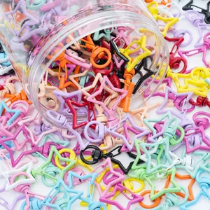 Vue détaillée de fermoirs pivotants en alliage en forme d'étoile colorée pour DIY