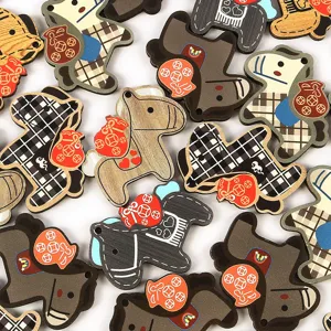Macro view showing decorative wooden horse charms for creative DIY jewelry making projects