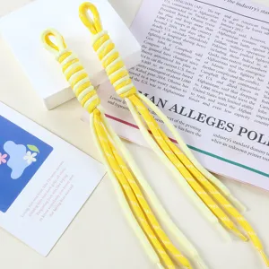 Close-up of dual-color yellow and cream hand-woven nylon lanyard for DIY bag charms