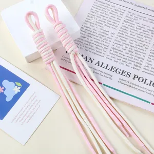 Close-up detail of two-tone pink and white braided nylon cord keychain for bag DIY charm