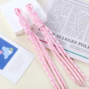 Close-up detail of pink and white two-tone nylon braided rope cords for DIY handmade bag charms