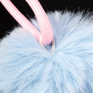 Light blue faux fur pom pom pendant with pink cord, fluffy DIY handmade accessory material.