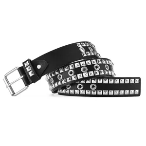 Detailed view of punk style black leather belt with silver pyramid studs and eyelets