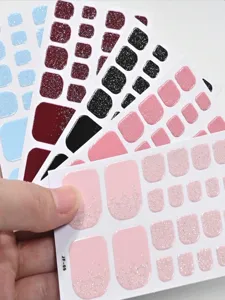Detailed view of assorted glitter and solid color toe nail stickers set