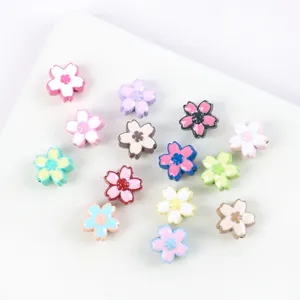 Variety of colorful enamel cherry blossom beads for DIY jewelry making and craft projects