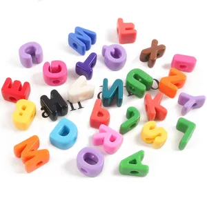 Close-up of colorful acrylic large-hole alphabet beads for DIY jewelry making