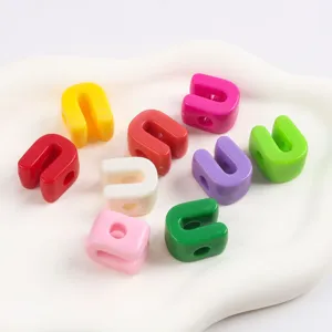 Macro view of colorful U-shaped acrylic beads used for DIY jewelry making projects