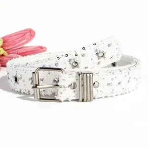 White Y2K denim belt for women, vintage style with star eyelets and shiny sequins detail.